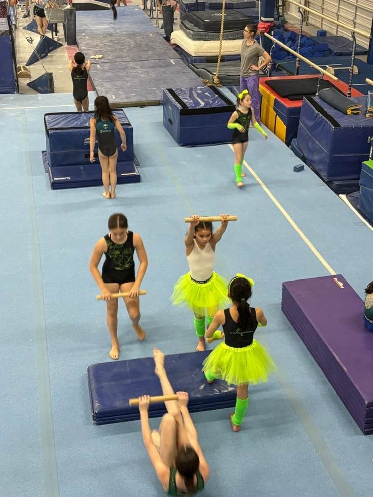 Children practicing gymnastics skills during Open Gym